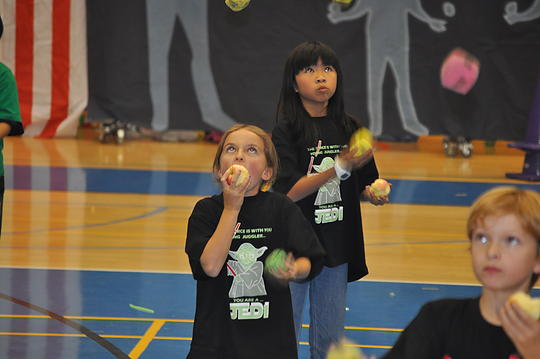 Yep, Ava can juggle and eat an apple at the same time!