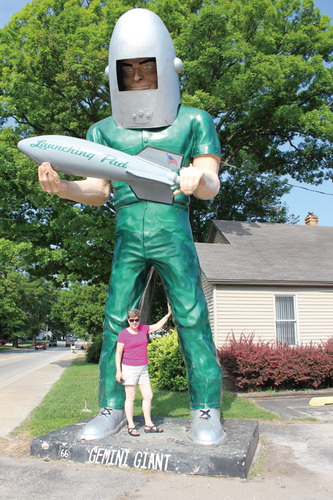 Julie poses with the Gemini Giant in Wilmington, Illinois
