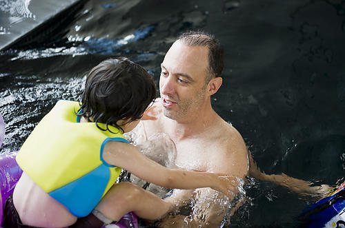 Father and son taking a splash in the pool!
