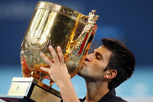 Novak plants a smacker on the trophy