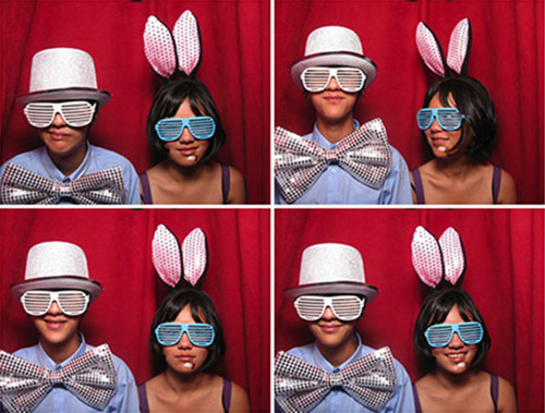 The classic photobooth at work, complete with classy red curtain
