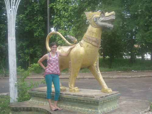 Chan Trier Rhodes (age 13) with a Cambodian lion statue