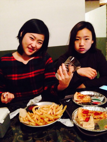 An at an eatery with her sister when she came to visit a while back