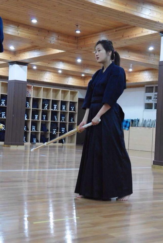 An holding her wooden sword during Kendo practice