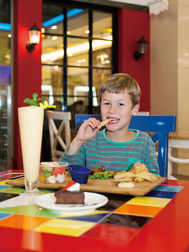 Kriss Baskevics ( 7, attends Beijing BISS International School) loves the grilled chicken wings