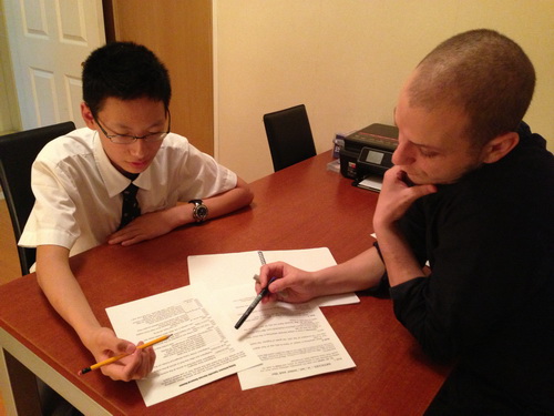 Elmasri reviewing homework with student Justin