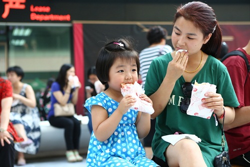 Mom and daughter have a bite