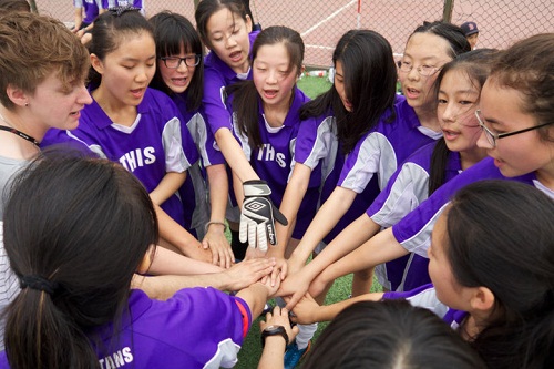 the girls' soccer team gets pumped up for a game