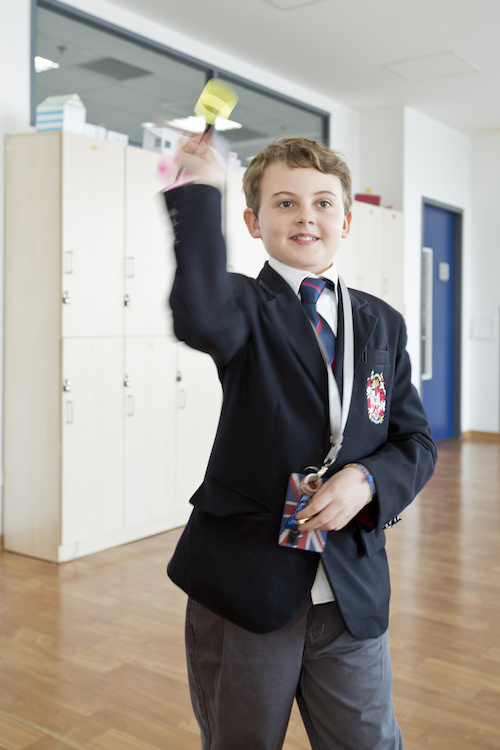 DCB Year 7 student Cameron throws the paper airplane he made for his mathematics class