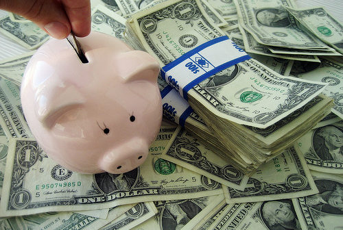 Saving Money in a piggy bank
