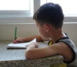 Asian kid writing