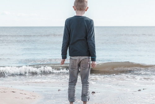Boy looking over the sea