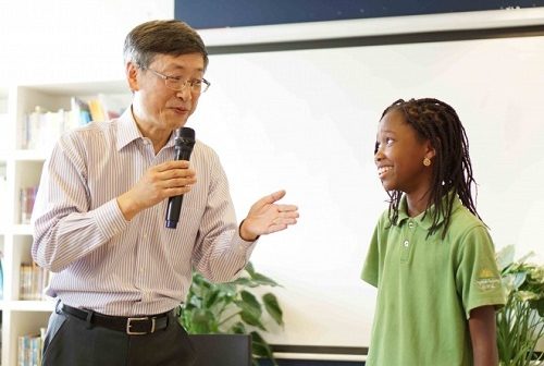 Jing Huang with a Daystar Academy student