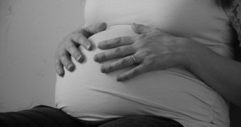 Pregnant Woman holding belly