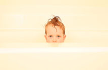 Wet Kid in Bathtub