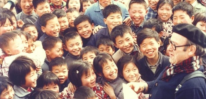 Old man with crowd of fans