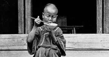 Child_Eating_Rice_with_Chopsticks